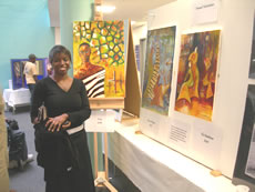 Hannah Hasiciimbwe with paintings