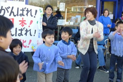 children dancing with teacher