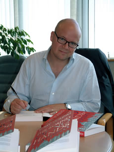 Toby signing books