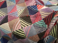 Unusual patchwork knitted bedcover